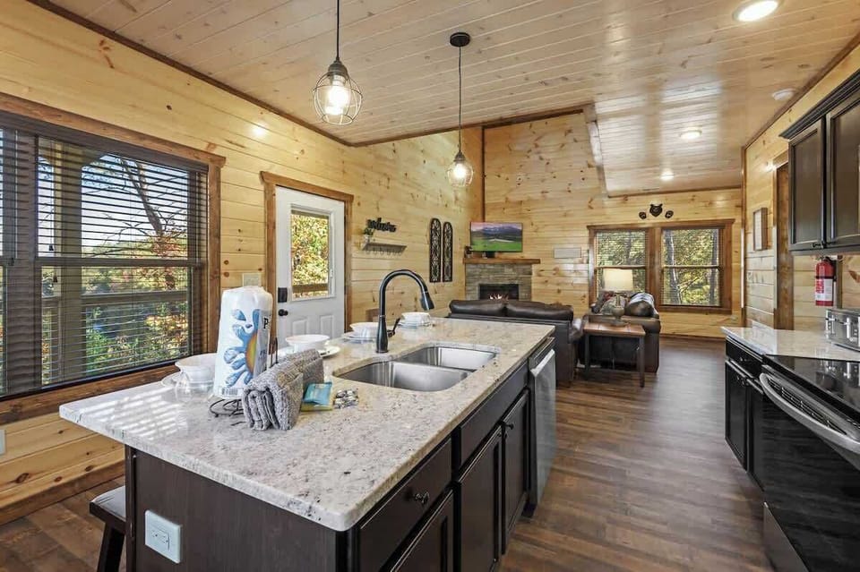 Modern state of the art Fully functioning Kitchen and large granite countertop with seats