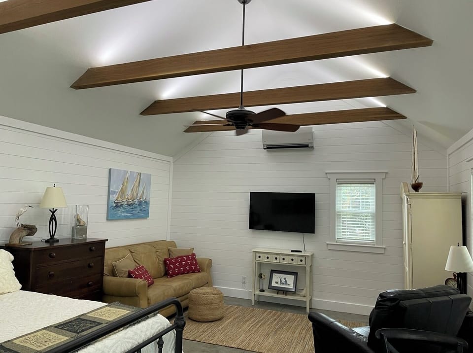 Exposed Solid Walnut Beams with accent lighting