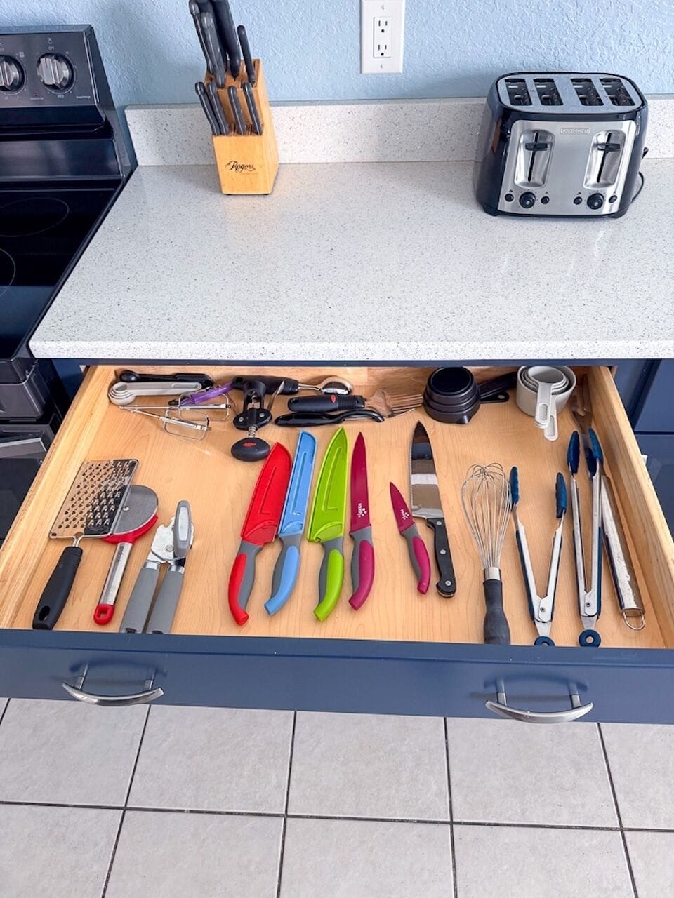 Kitchen drawers are stocked with all basic cooking utensils 