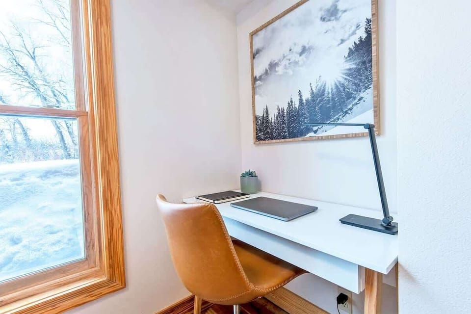 A well lit workspace & fast internet make for easy remote working. MacBook not included :)