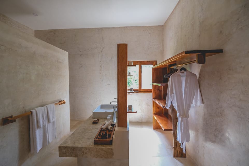 Junior Suite, Terrace | Bathroom | Shower, rainfall showerhead, designer toiletries, towels