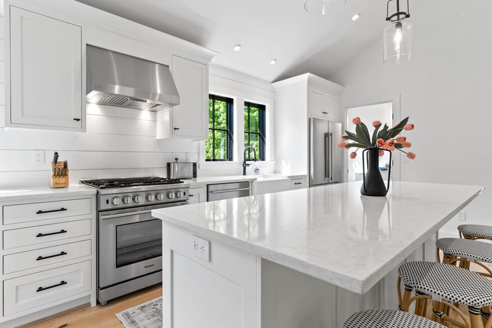 Kitchen with gas range, large island that seats 4