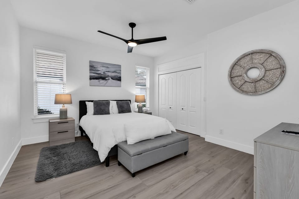 Large guest bedroom with queen bed; plenty of closet space; 52” ceiling fan