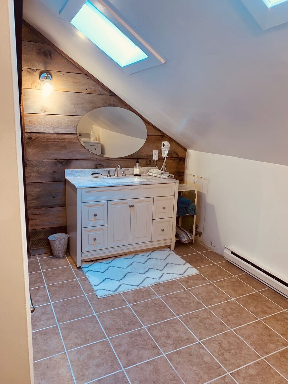 Main Bathroom with Large walk-in shower and laundry area washer/dryer