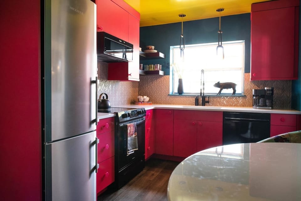Fully stocked kitchen with bold cabinetry and an open layout for easy cooking and entertaining.