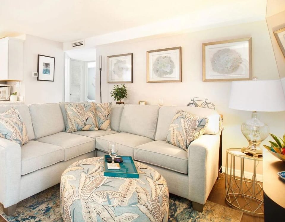 Cozy living room with a huge couch and a smart tv
