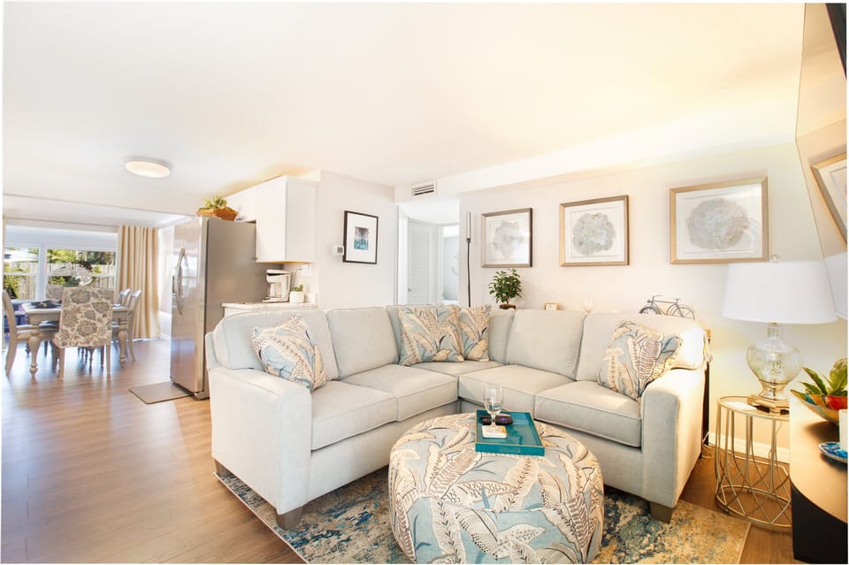 Cozy living room with a huge couch and a smart tv
