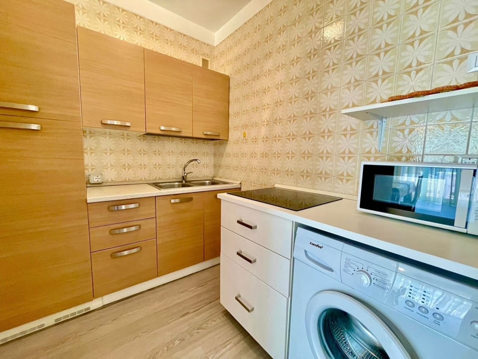 Apartment, 1 Bedroom, Balcony, Pool View | Laundry