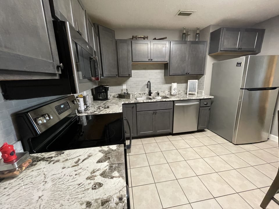 Kitchen, renovated, wood cabinets, Granite, Stainless Steel appliances and tile