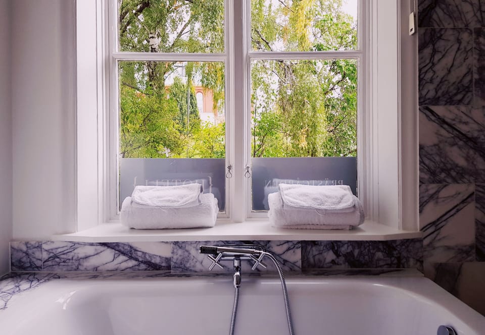 Designer toiletries, hair dryer, heated floors (bathroom), towels