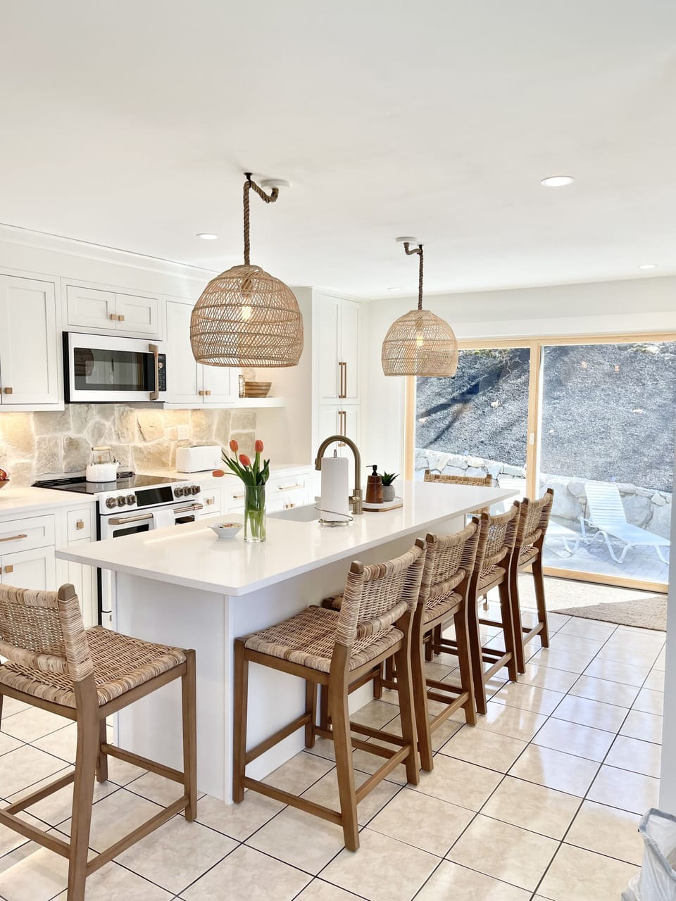 Newly renovated kitchen with island, oversized slider, pantry & storage closet. 
