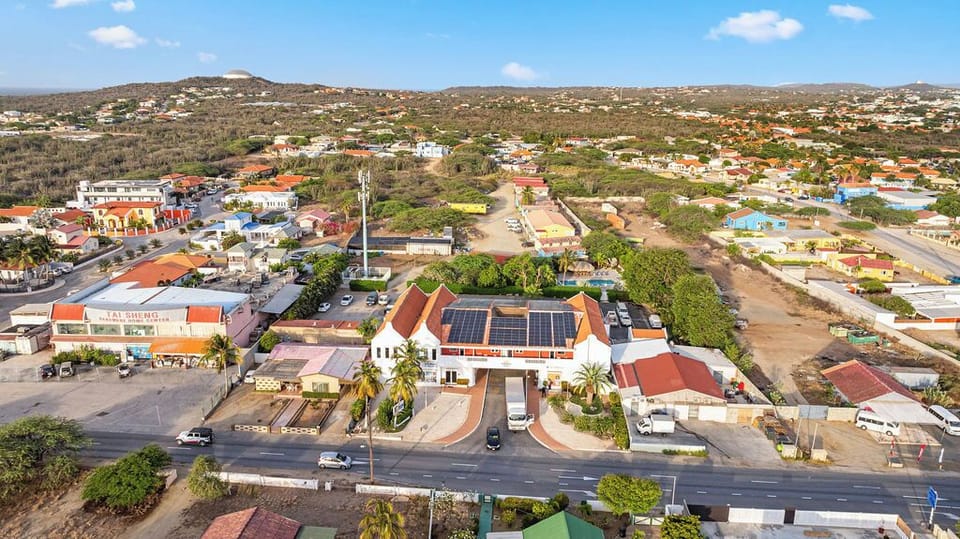 Aerial view of the property and neighborhood