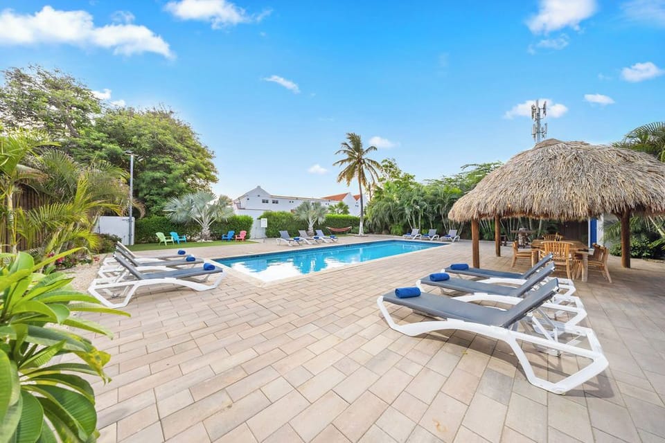 Lounge chairs are positioned around the pool, creating a serene and inviting atmosphere for guests to relax and unwind.