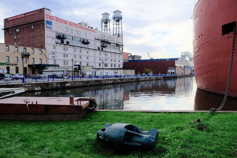 Suite sits beside the water, offering a peek at boats & the dock.