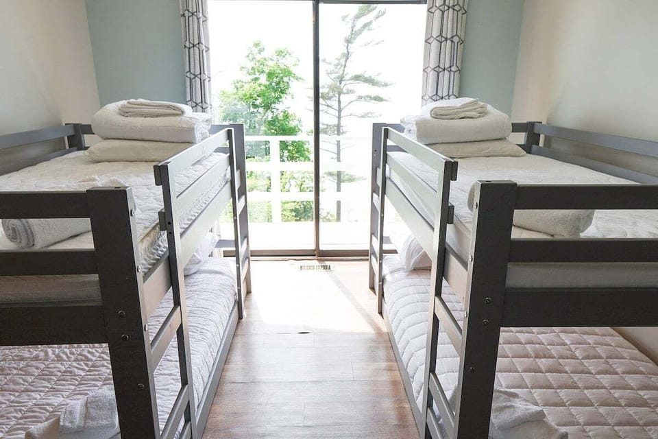 Upstairs Bedroom 4 with Two Twin Bunk Beds and Balcony Access