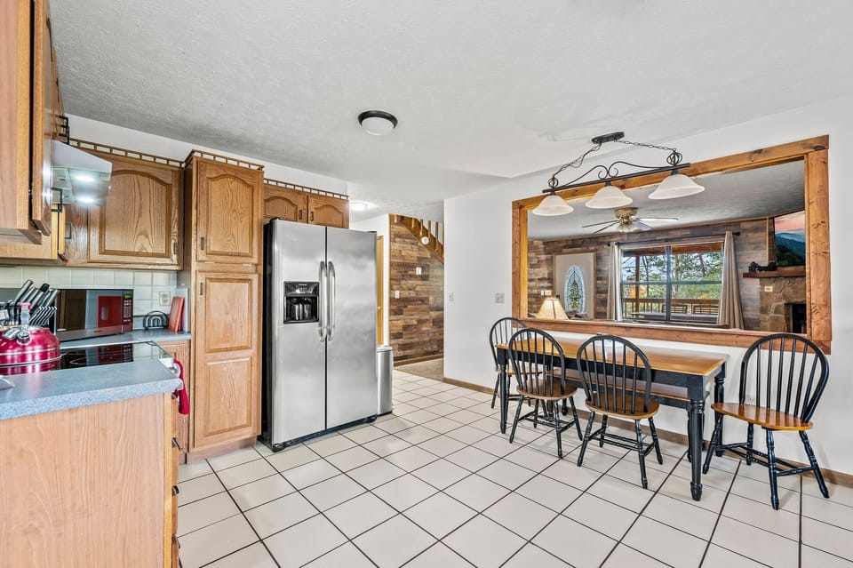 Find a well-stocked kitchen adjacent to the living room