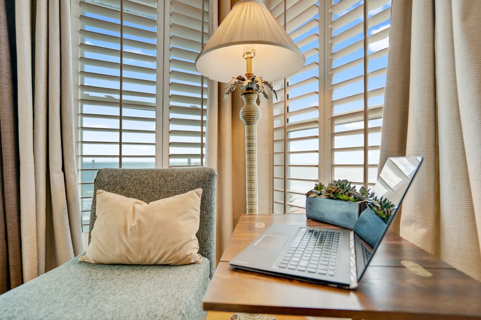 A dedicated "workcation" space with portable laptop desk.