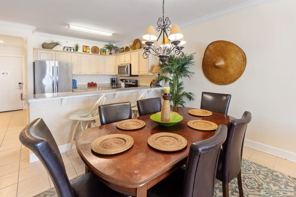 Your spacious dining area seamlessly connects to a fully equipped kitchen, perfect for sharing memorable meals together.