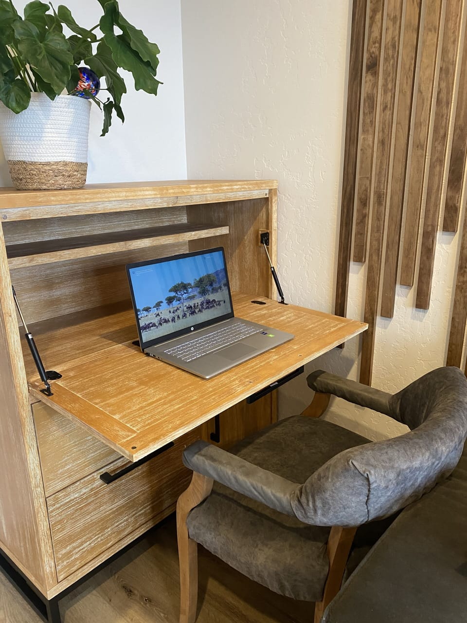 hidden desk with plugins for computer and phones