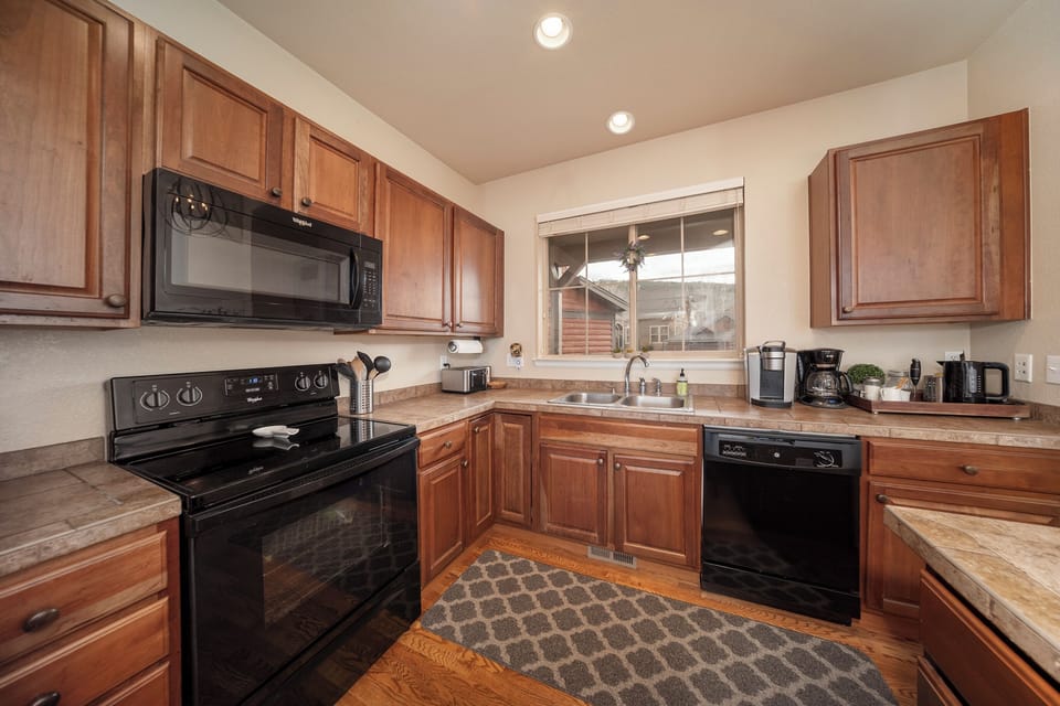 The spacious kitchen has a great mountain view and plenty of counter space. 