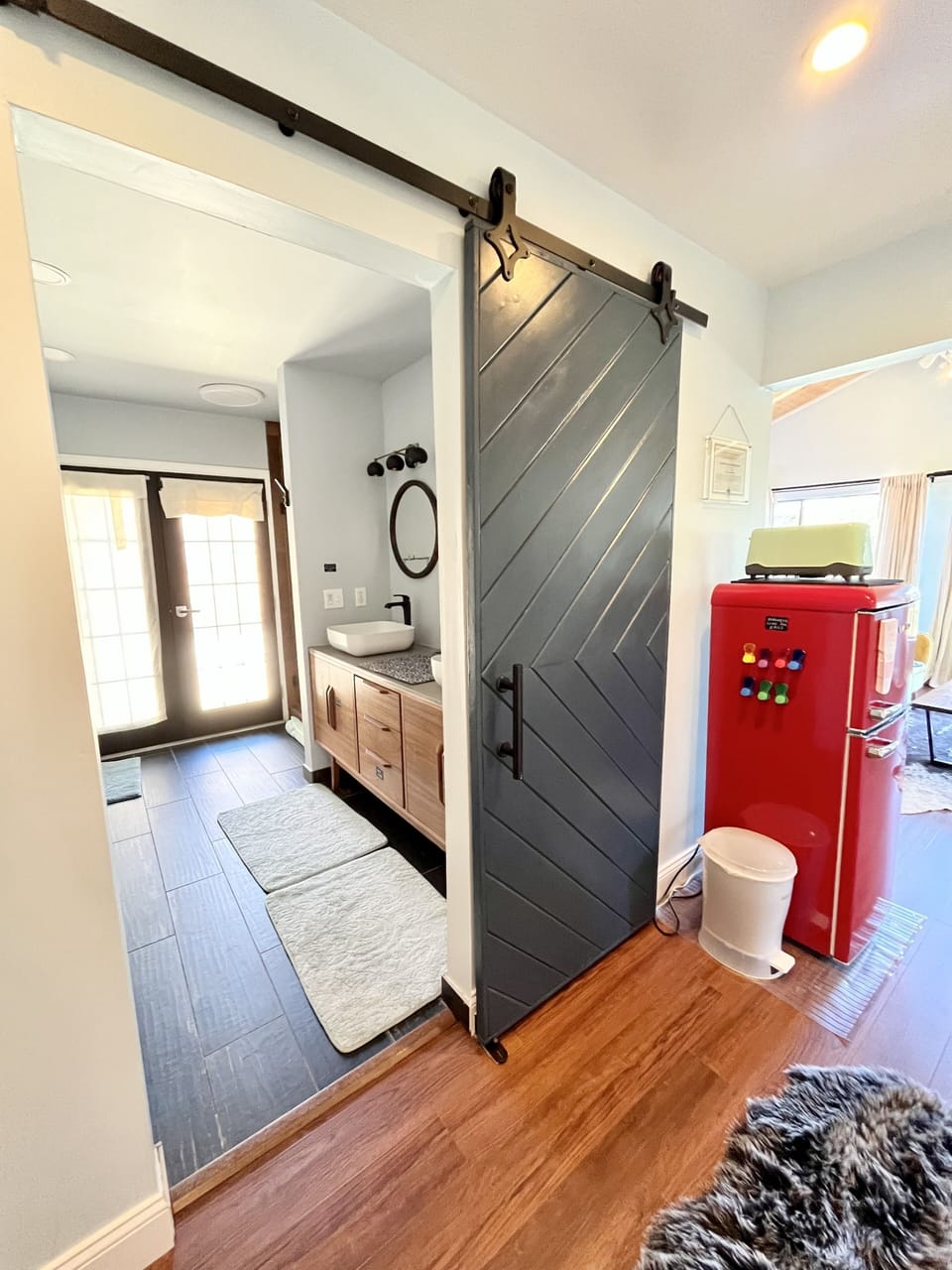 Enter the bath through the barn door