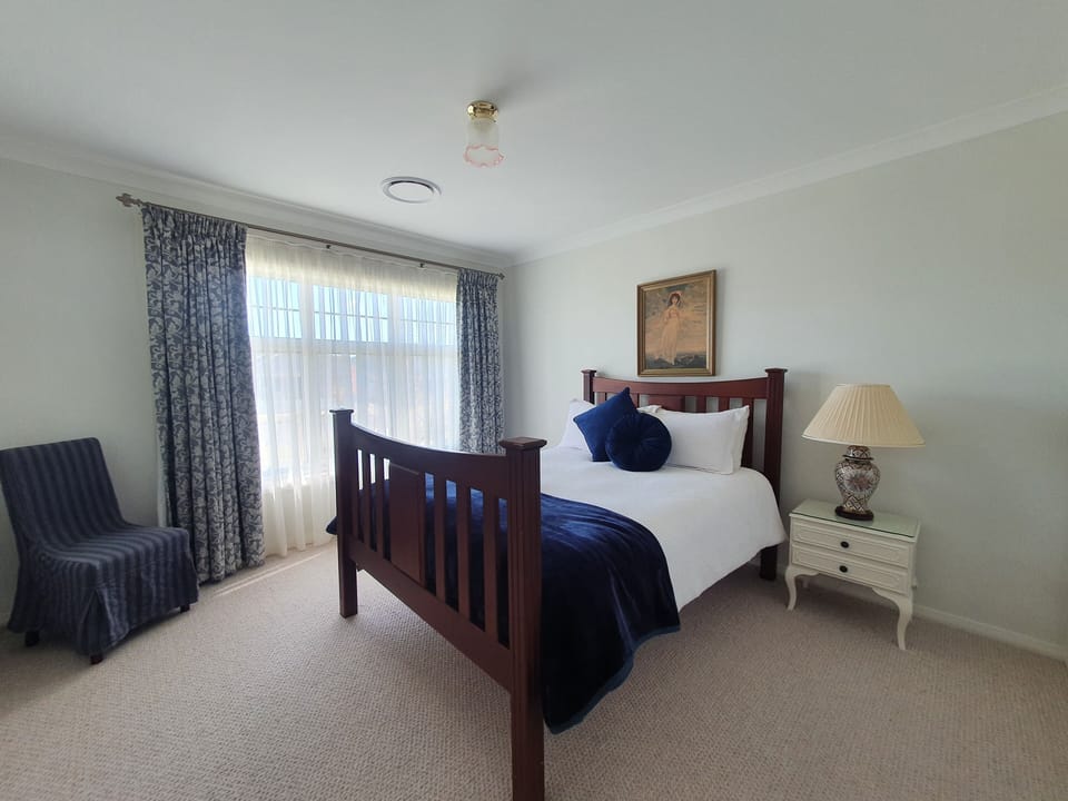 Spacious bedroom (Queen bed) with built in robes for a longer stay.