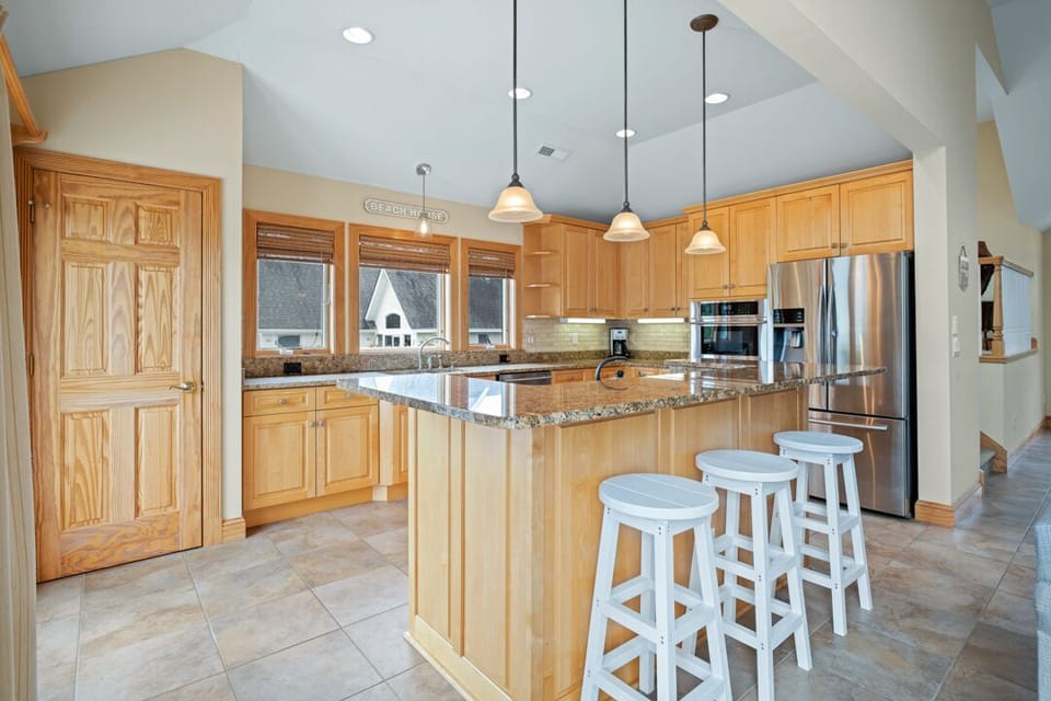 Large Kitchen with Bar Stool Seating on Third Level