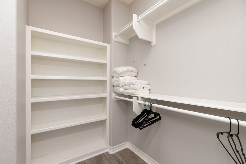 Your spacious walk-in closet features custom shelving and hanging space to keep your belongings perfectly organized during your stay.
