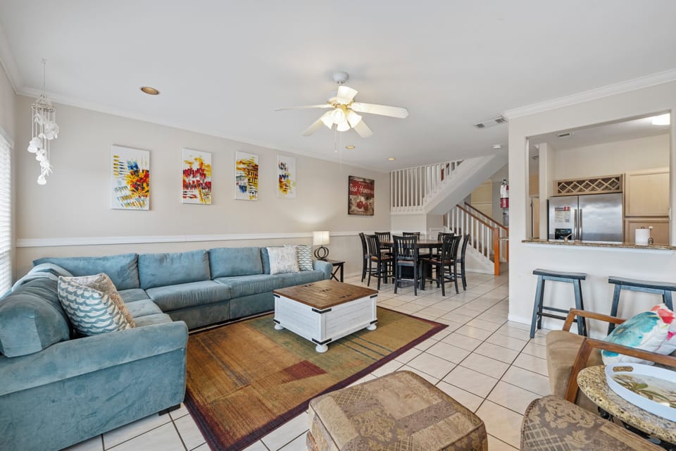 Relax in your spacious open-concept living area where comfort meets style, with cozy seating and modern amenities for your perfect getaway.