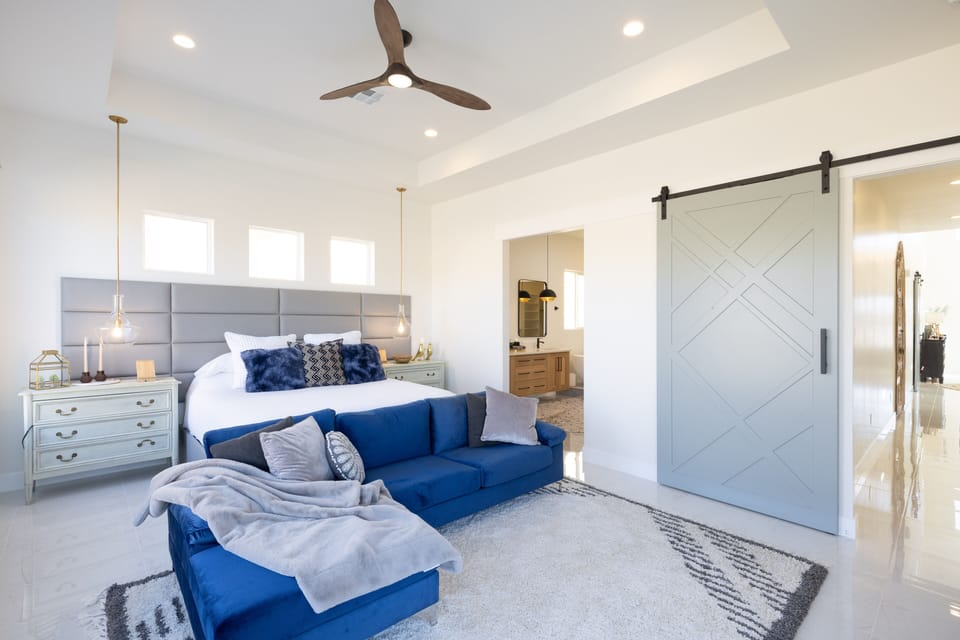 Main Bedroom - The main bedroom is furnished with a plush King bed, private TV, and walk-in closet.