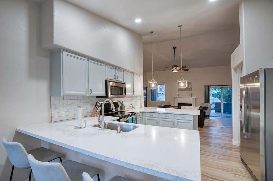 Bright, open concept space with bar seating for 4 and dining for 6.