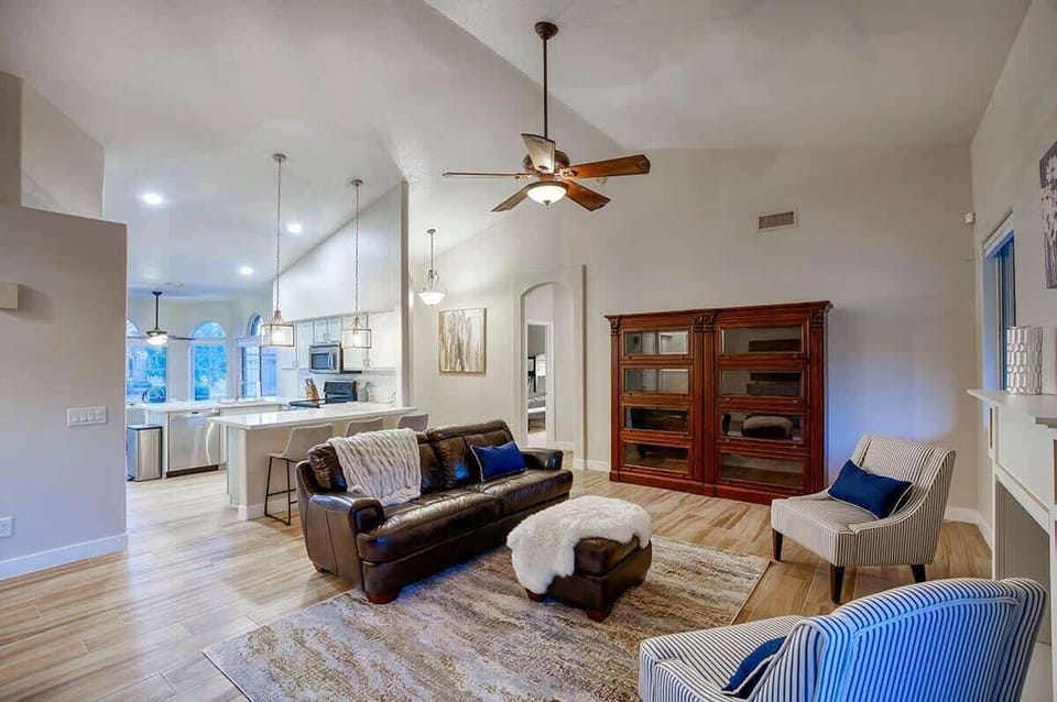 Newly renovated living room with 60" TV and plenty of seating.