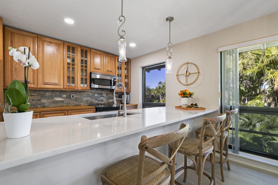 Stunning renovated kitchen. A social space at the quartz countertop.