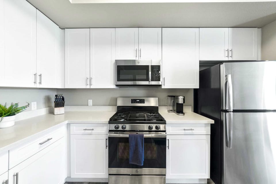 Full kitchen with stainless steel appliances.