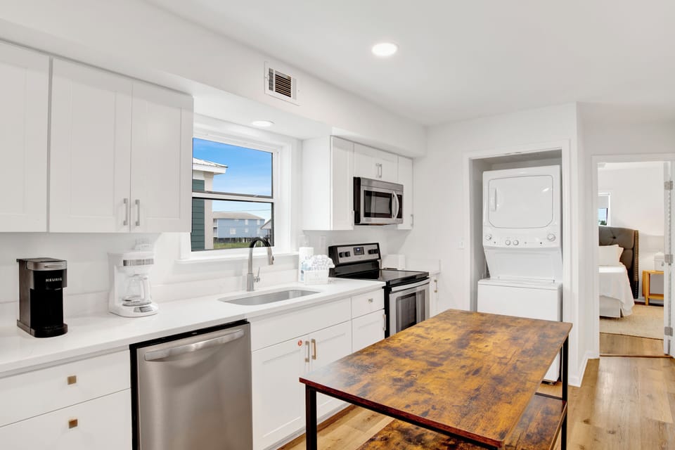 A stackable washer and dryer is located on the first floor for guests convenience