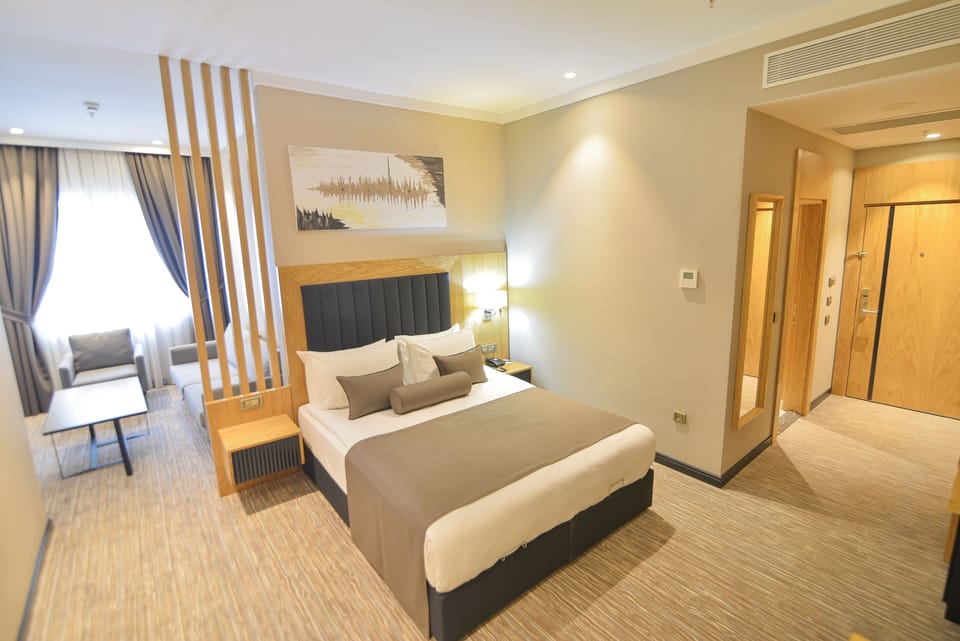 Deluxe Room | Premium bedding, minibar, desk, laptop workspace