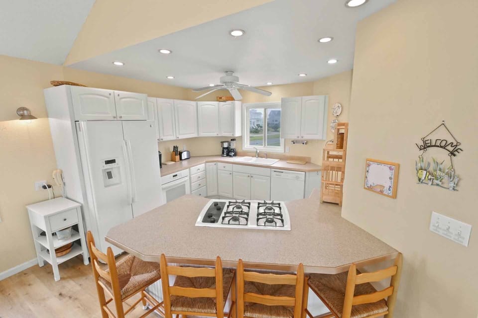 The well-equipped kitchen has everything need to plan and prep a meal.