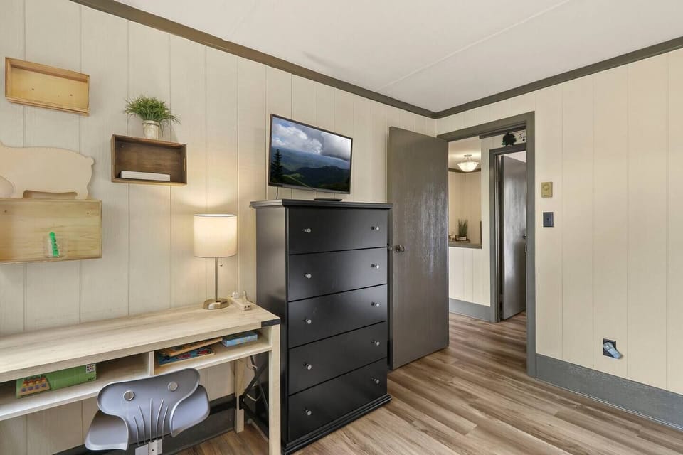 dedicated work space in bedroom 3, dresser, smart tv