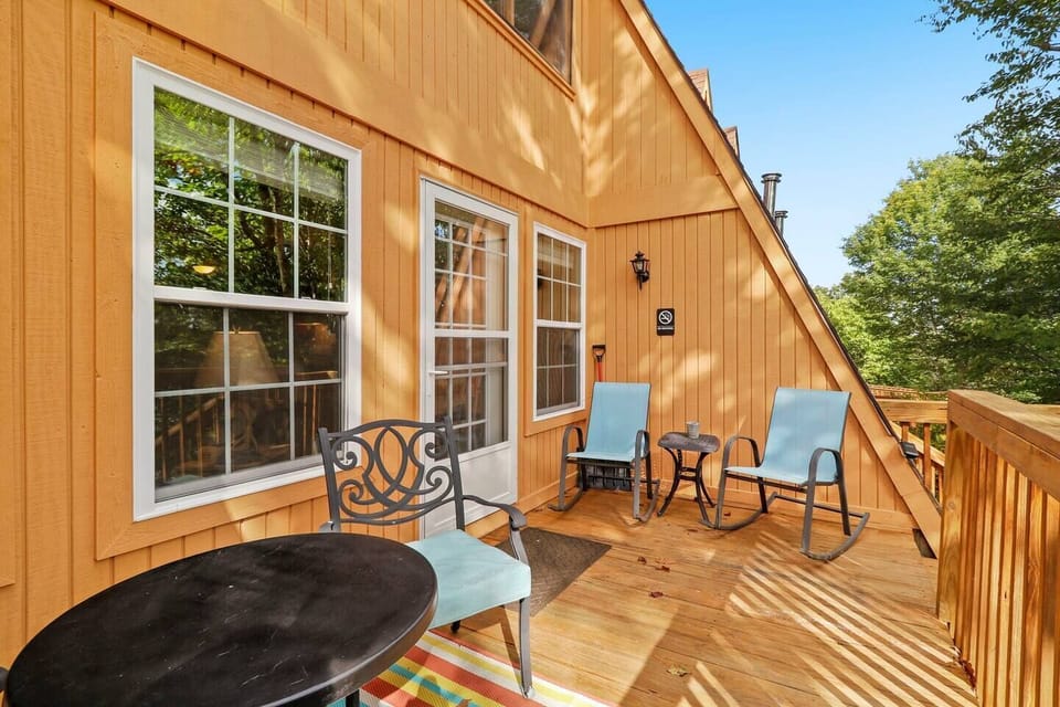 seating for four and two tables on the back balcony just of the dining room