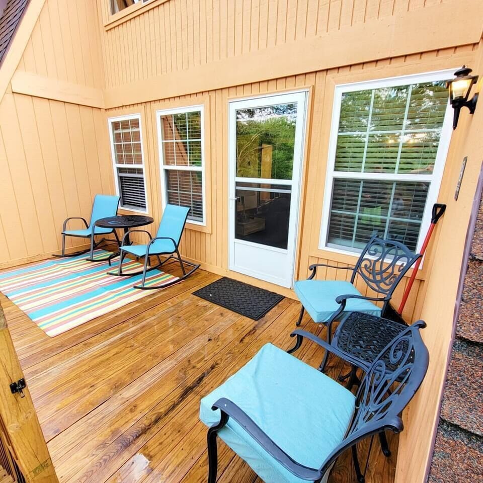 Back balcony has seating and tables perfect for enjoying the fresh mountain air
