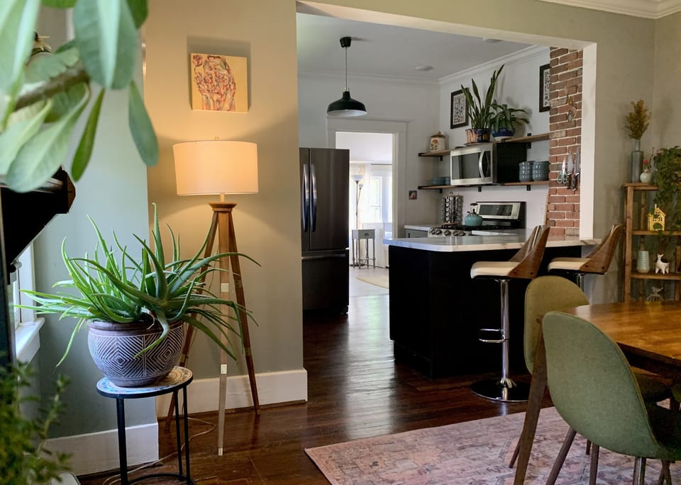 Living plants feature prominently throughout the space.