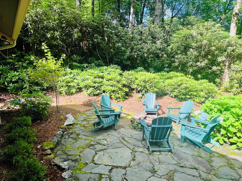 Outdoor fire pit with beautiful rhododendrons
