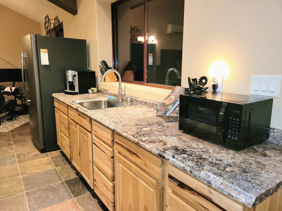 There is also a deep skillet with cover for cooking in cabinet