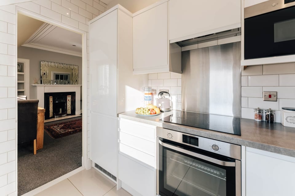 Bright open plan kitchen leading to living room