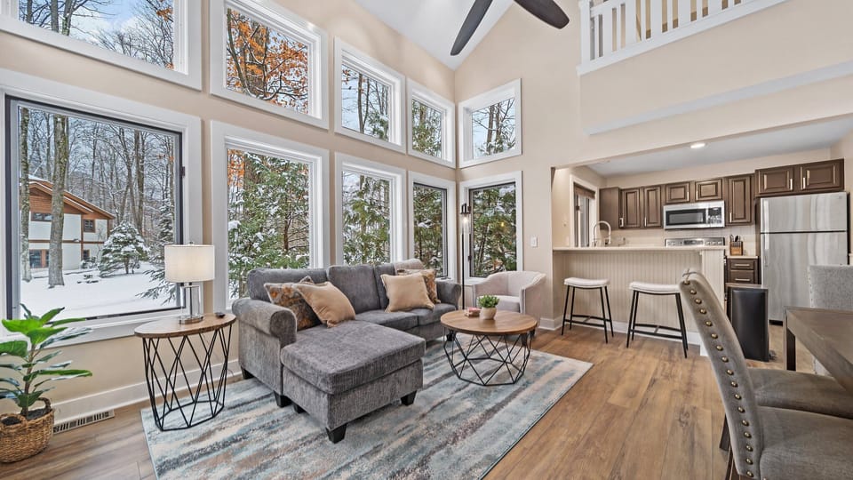【Living + Dining Area】Large two story stacked windows light up the space for all your family