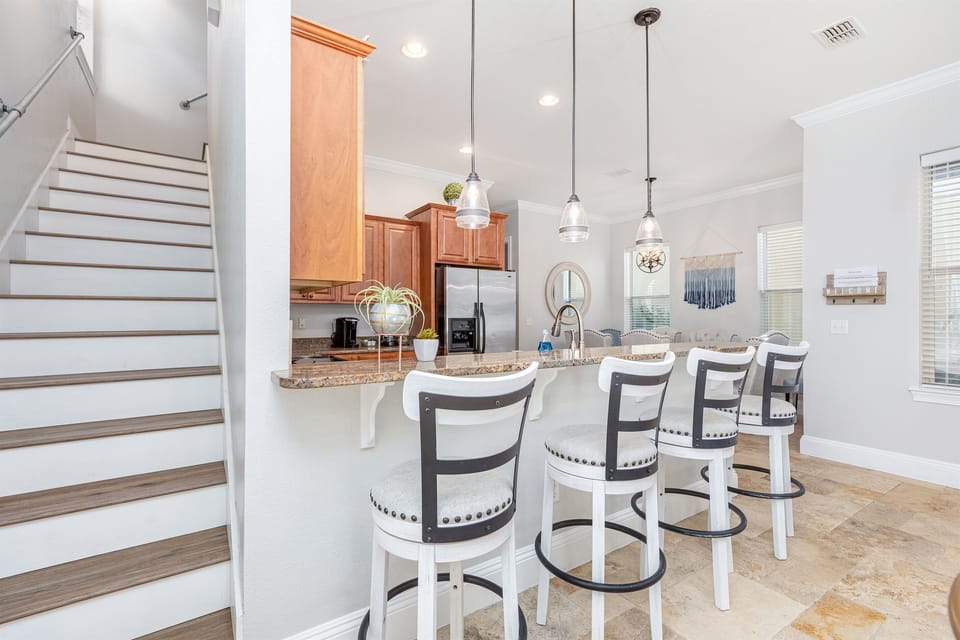 Kitchen counter with bar stools