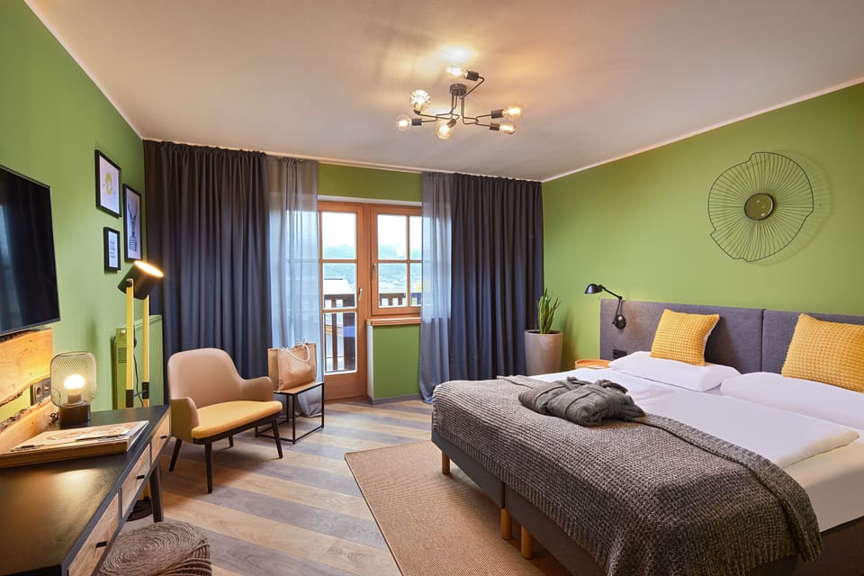 Deluxe Double Room | Minibar, in-room safe, desk, blackout drapes