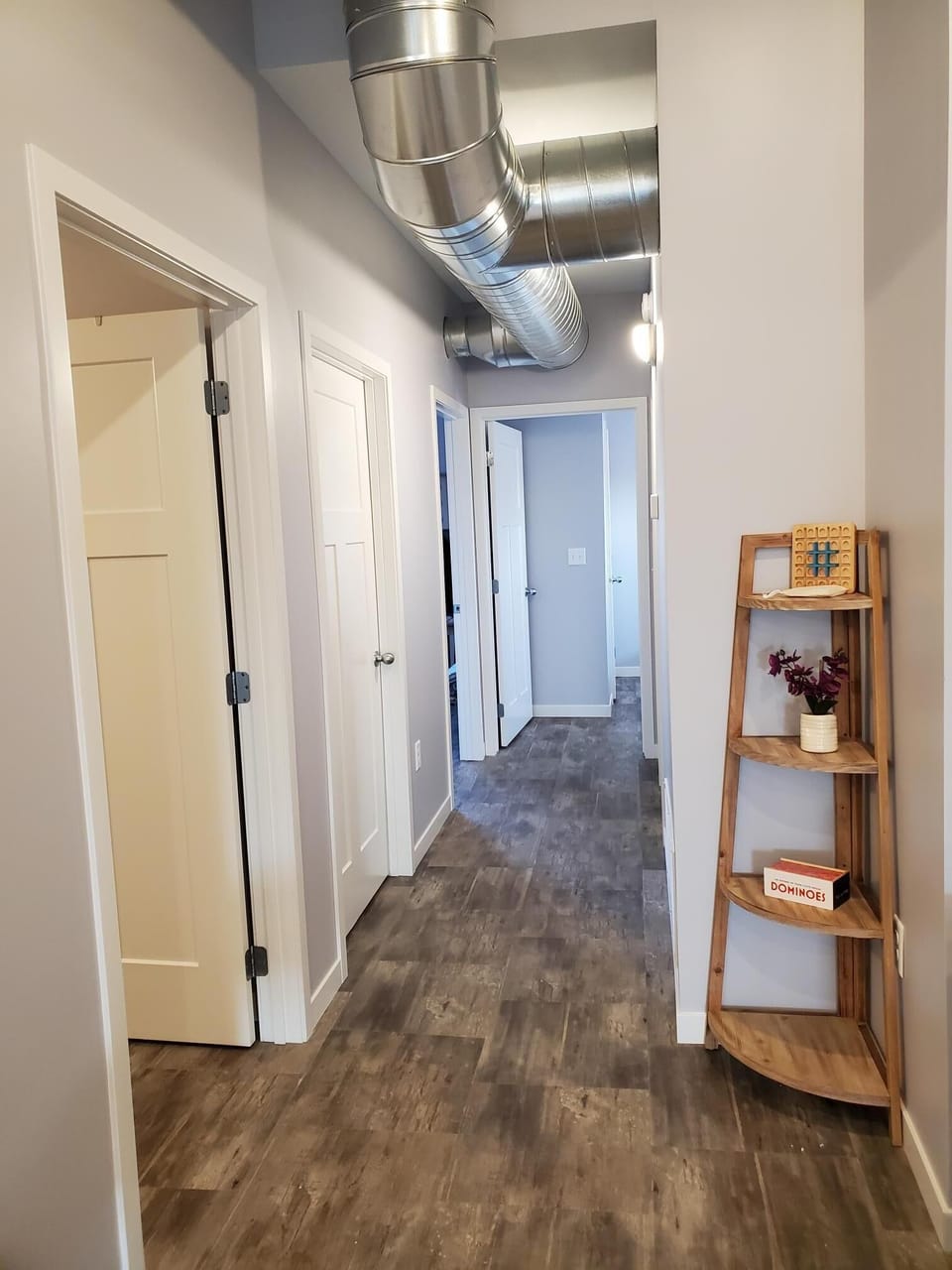Bathroom, laundry and two bedrooms down the hallway.