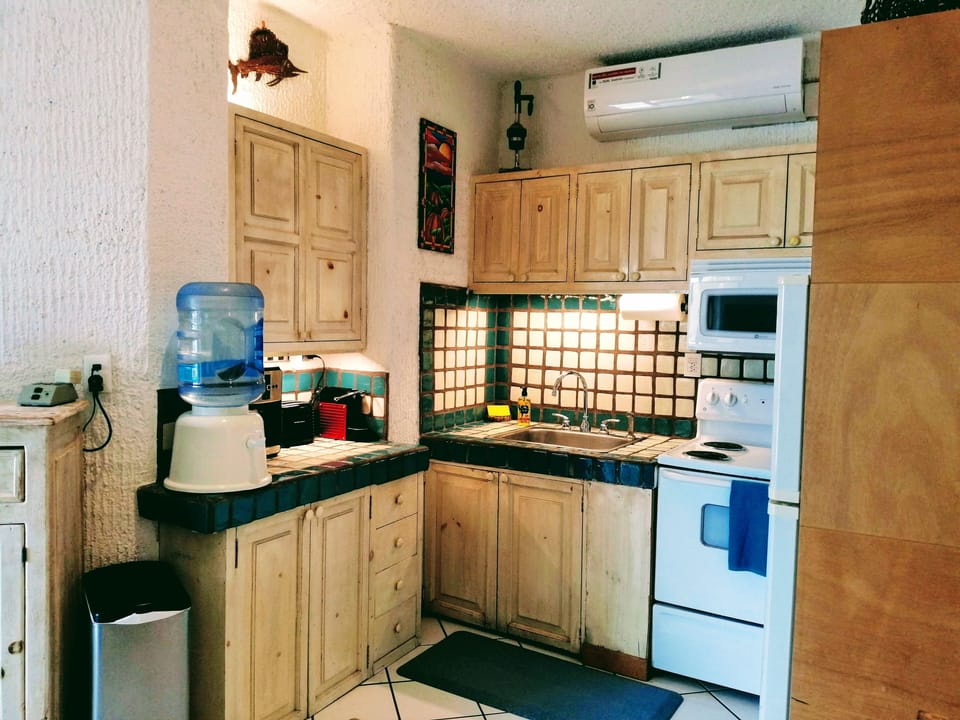 The kitchen is compact and has everything you need, including a washer/dryer.
