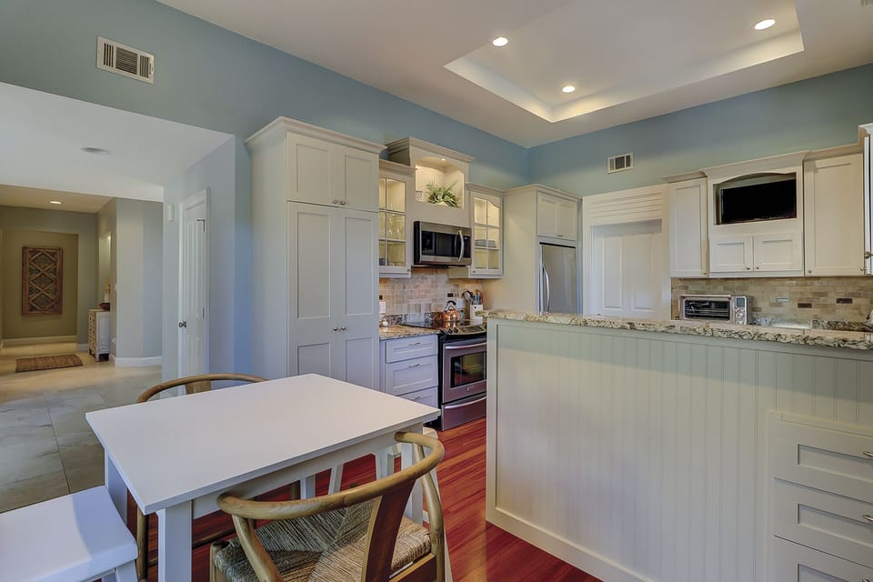 bar height table in kitchen dinette area with seating for 4